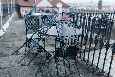 Restaurant terrace with tables and chairs waiting for client outdoorの写真素材