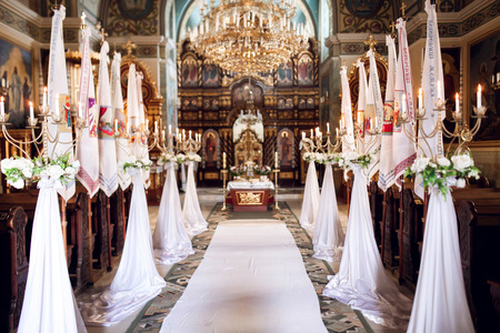 Interior of church with decoration for wedding with candels light natureのeditorial素材