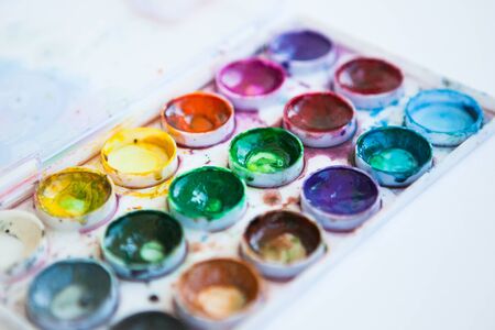 Set of multicolored watercolor paints on the white backgroundの写真素材