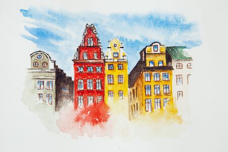 Watercolor drawing of an old town isolated on the white background. Illustration of colorful old buildings, houses.の写真素材
