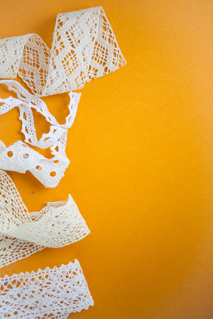 White laces on yellow background with the copy space for your text