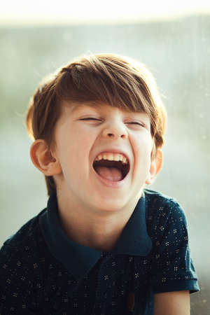 Portrait of the laughing boy. Toddler, close up portrait.の写真素材