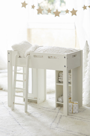 White knitted storage basket under white console tableの写真素材