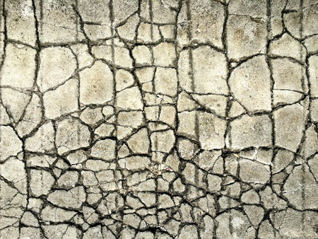 Textured background of cracked concrete cement sidewalk foundation