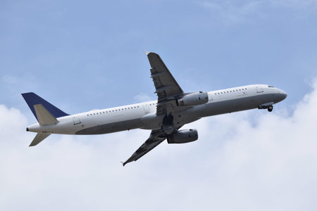 Plane taking off among clouds