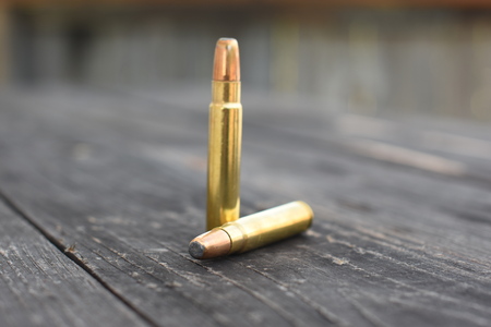 Two 416 Ammunition on the wooden backgroundの写真素材