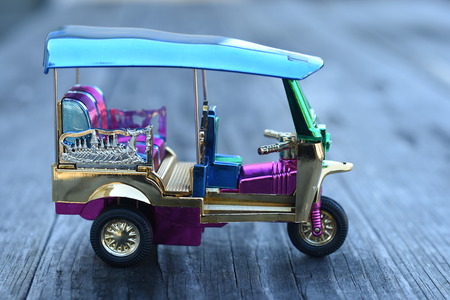 Colorful Tuk Tuk Model on wooden backgroundの写真素材