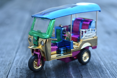 Colorful Tuk Tuk Model on wooden backgroundの写真素材