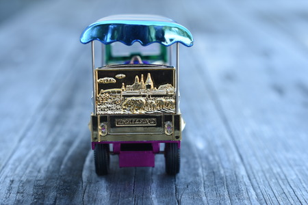 Colorful Tuk Tuk Model on wooden backgroundの写真素材