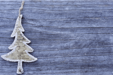 Tree shape ornament on the wooden backgroundの写真素材