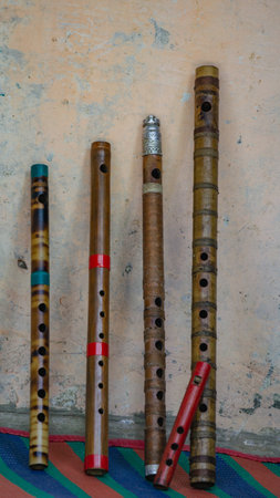 Flute of Bangladesh. Handmade bamboo flute. The flutes are arranged in rows.の写真素材