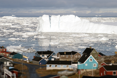 Greenland glacier glaciers houses ocean small town burg skyの写真素材