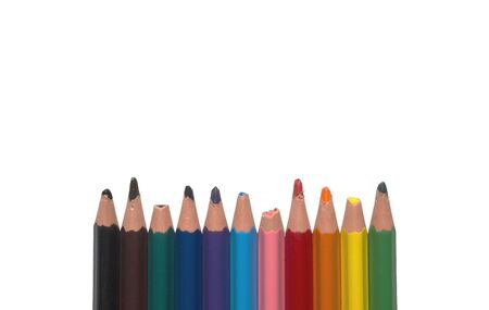 blunt pencils broken used colored not new children childrens in one row line isolated close up closeupの写真素材
