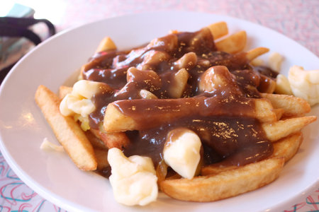 poutine, canadian cuisine. poutine had become part of the canadian cuisine identity.