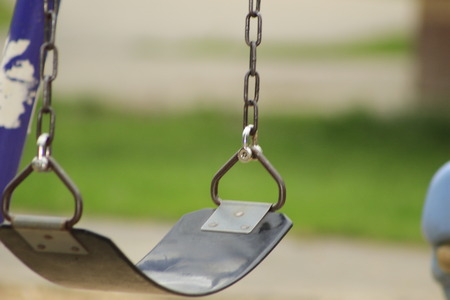 Swing Set at a school playground, slective focusの写真素材