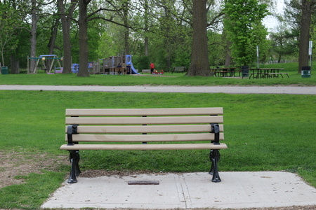 Wooden bench in the city parkの写真素材