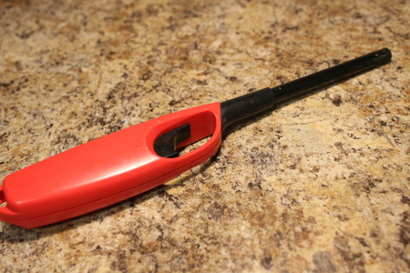 barbecue lighter isolated on a marble backgroundの写真素材
