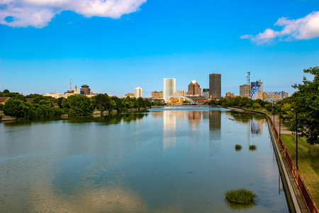 Skyline of Rochester, New York along Genesee River at sunset.の写真素材
