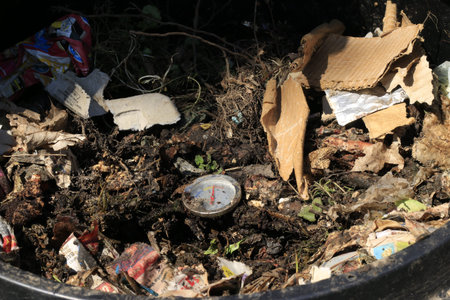 Compost Bin with Food Scraps and Grass Cuttings.