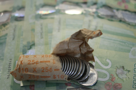 Overhead Closeup of Canadian silver Coins and Loonies spread out.の写真素材