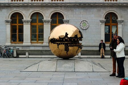 Dublin Ireland, February 18 2018: Editorial photo of tourists looking at the popular "sphere within a sphere".のeditorial素材