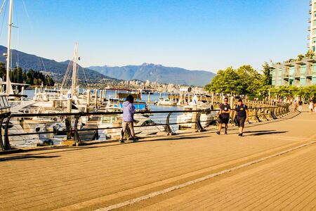June 18 2018, Vancouver Canada, Editorial photo of false creek dock showing the magnificent boats that are docked.のeditorial素材