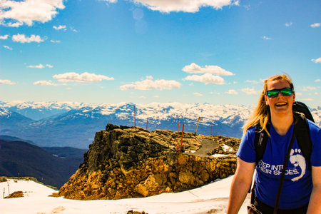 June 16 2018, Whistler Canada: Editorial photo of a girl joyfully laughing on a mountain.