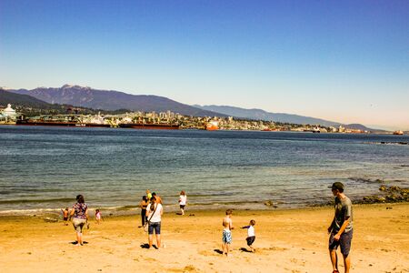Vancouver Canada, June 18 2018: editorial photo of a beach on the sea walk at stanley park. A nice family eventのeditorial素材