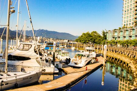 June 18 2018, Vancouver Canada, Editorial photo of false creek dock showing the magnificent boats that are docked.のeditorial素材