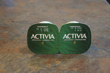London Canada, June 09 2020: Editorial illustrative photo of activia yogurt containers. Theme of eating healthyのeditorial素材