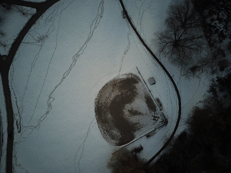 aerial photo of a baseball diamond in the winter.
