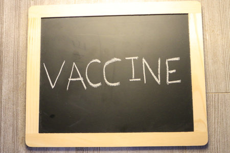 vaccine themed images with the word vaccine on a blackboardの写真素材