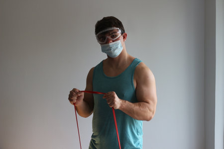 Man works out with maskの写真素材