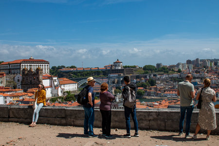 Tourists looking at the old town of Porto, Portugal.の写真素材
