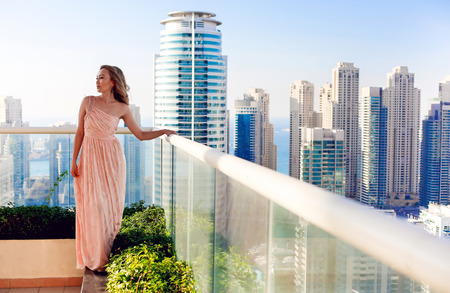 Beautiful woman and Dubai Marina Viewの写真素材