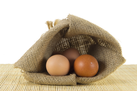 Open sack of eggs isolated on white backgroundの写真素材