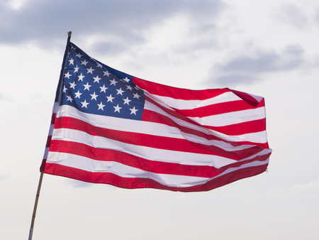 United States Flag on Background of Sky