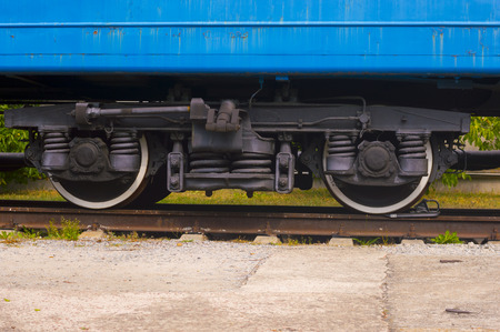 Train Wheels on Railroad. Detail of  Rustic Blue Wagonの写真素材
