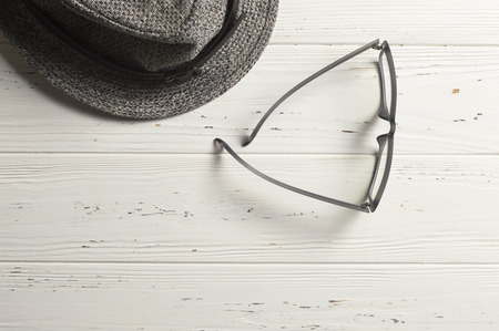 Optical Glasses and Retro Straw Hat on Wooden backgroundの写真素材