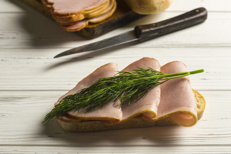 Sandwitch, Dill and Knife on White Wooden Tableの写真素材