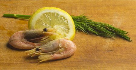 Shrimp, Dill and Lemon on Ð¡utting Boardの写真素材