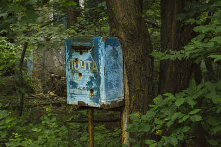 Old Rusty Mailbox in Ghost City of Pripyat. Text on the mailbox: "mail"の写真素材