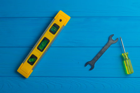 Working Tools on Blue Wooden Background