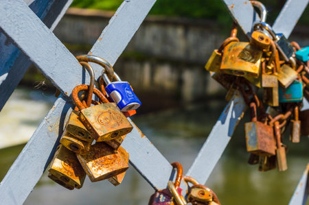 CLUJ-NAPOCA, ROMANIA - JULY 29, 2018: love padlocks on  Elizabeta Bridge railing  on Somes River in...