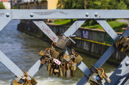 CLUJ-NAPOCA, ROMANIA - JULY 29, 2018: old love padlocks on  Elizabeta Bridge railing  on Somes River in Cluj, Transylvaniaのeditorial素材