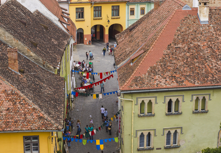 SIGHISOARA, ROMANIA - AUGUST 1, 2018: high angle view of town street in historical center of Sighisoara, Transylvaniaのeditorial素材