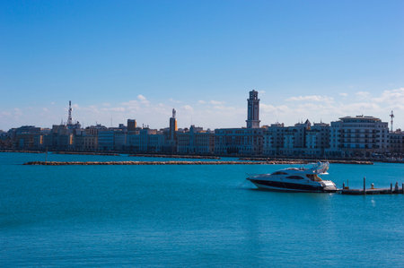 BARI, ITALY - FEBRUARY 16, 2020: general view of Bari city embankment and motorboat on foreground