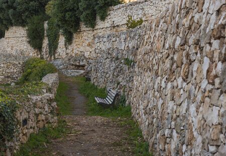 Path Among Stone Walls in Public Garden in Polignano, Italyの写真素材