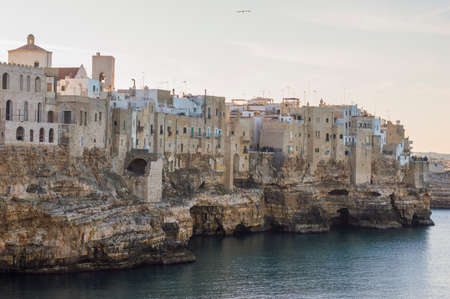 POLIGNANO A MARE, ITALY - FEBRUARY 17, 2020:  Steep rocky Adriatic shore at Polignano a Mare, Italyのeditorial素材