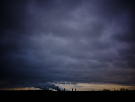 dark and dense smoke emitted by a power plant